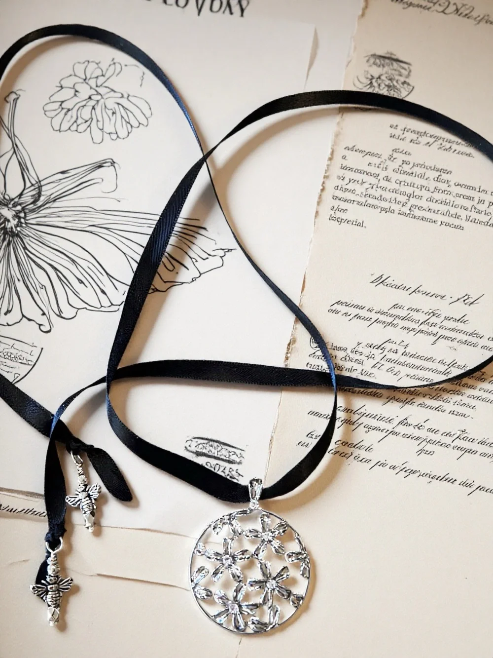 Silver Toned Floral Cutout Pendant Necklace on Black Satin Ribbon